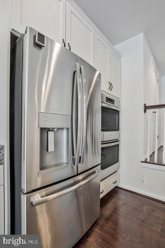 42523 Benfold Square Brambleton, VA 20148 - Photo 19 of 29 a metallic refrigerator freezer sitting in a kitchen