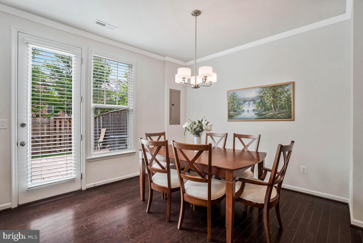 42523 Benfold Square Brambleton, VA 20148 - Photo 21 of 29 a view of a dining room with furniture window and wooden floor