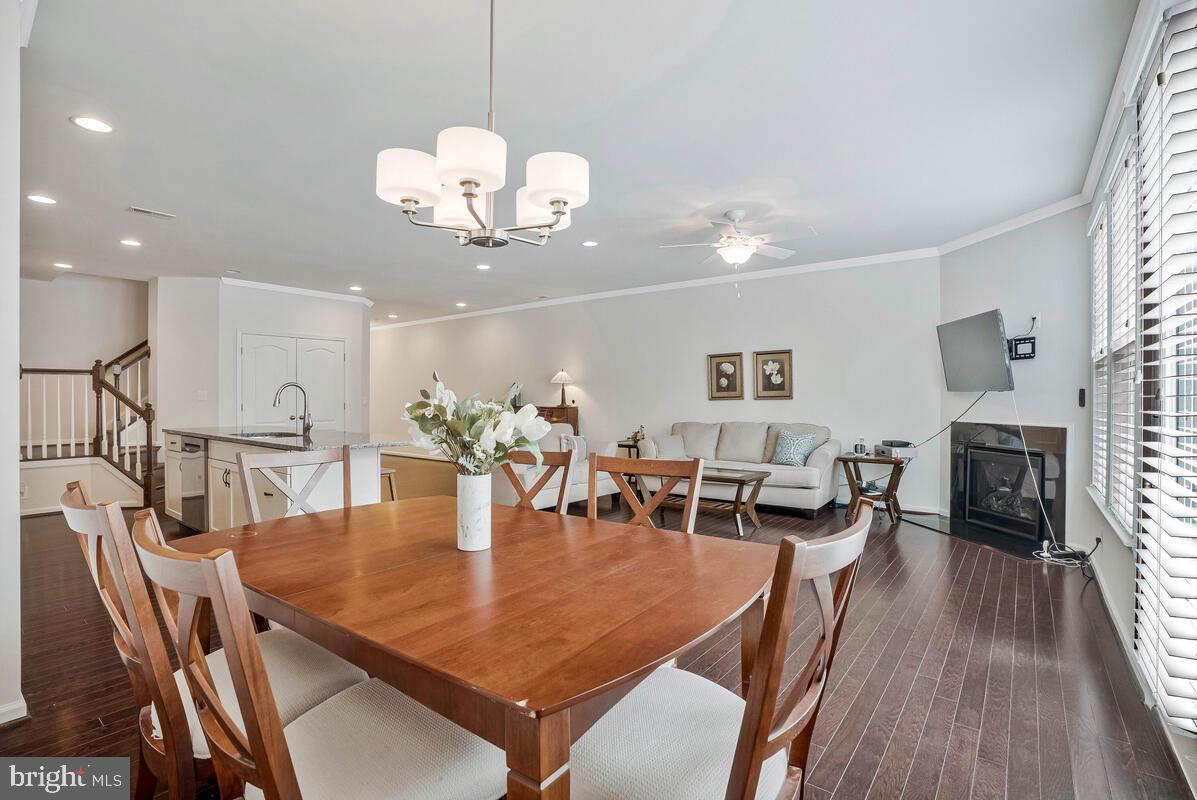 42523 Benfold Square Brambleton, VA 20148 - Photo 22 of 29 a view of a dining room with furniture and wooden floor