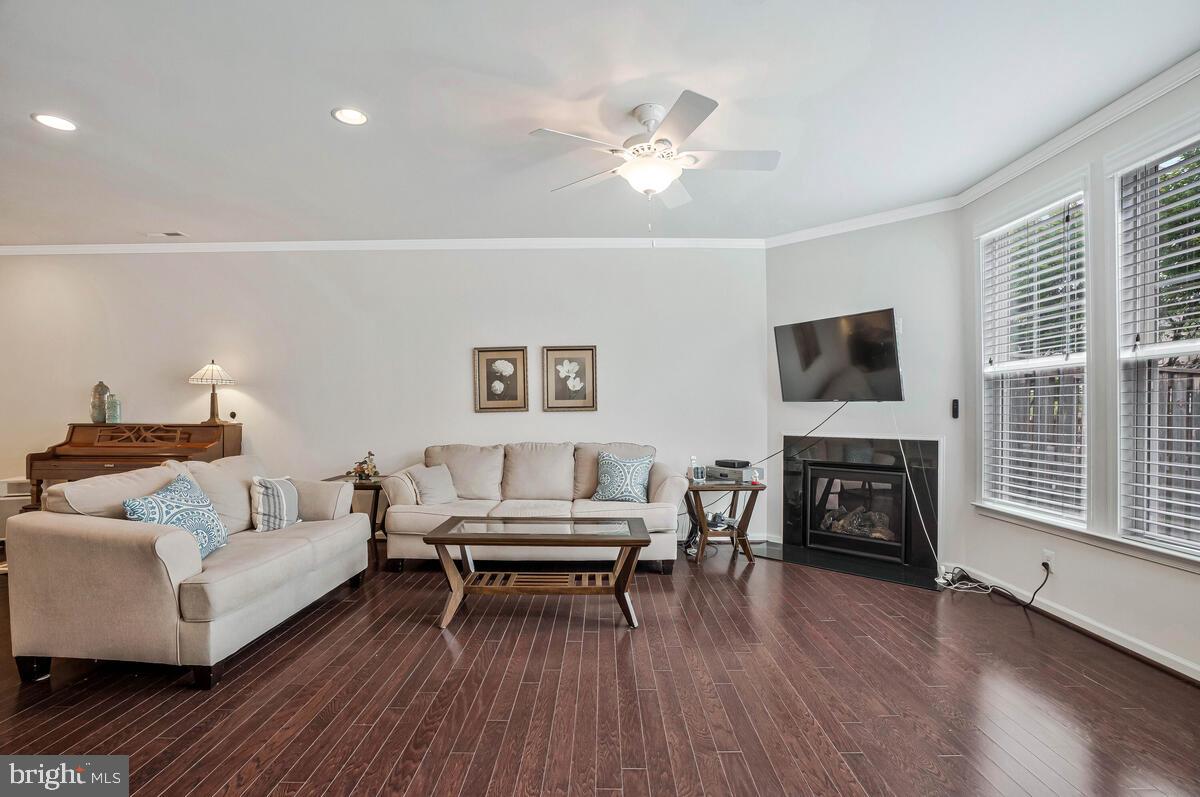 42523 Benfold Square Brambleton, VA 20148 - Photo 24 of 29 a living room with furniture and a fireplace