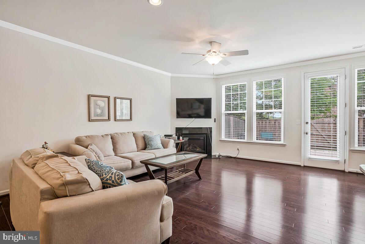 42523 Benfold Square Brambleton, VA 20148 - Photo 25 of 29 a living room with furniture large window and wooden floor