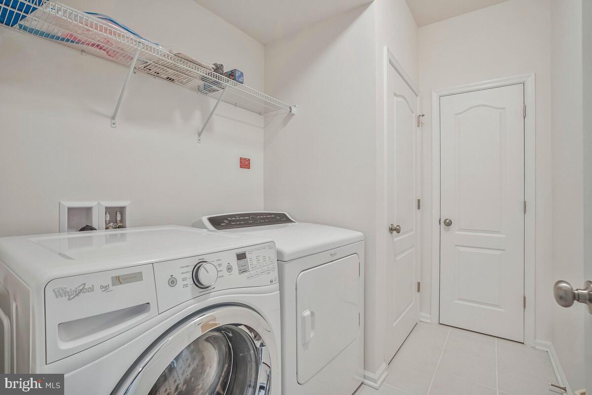 42523 Benfold Square Brambleton, VA 20148 - Photo 4 of 29 a utility room with dryer and washer