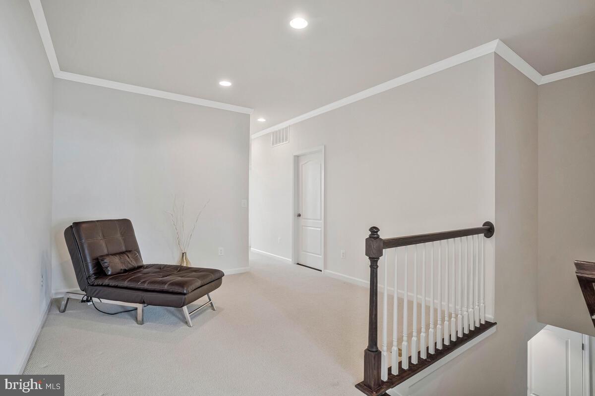 42523 Benfold Square Brambleton, VA 20148 - Photo 9 of 29 a view of a room with wooden floor and chair