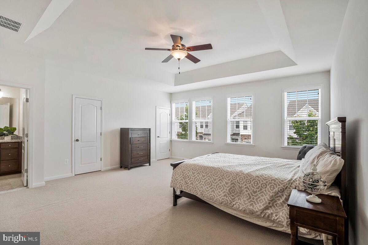 42523 Benfold Square Brambleton, VA 20148 - Photo 10 of 29 a bedroom with a bed and a couch