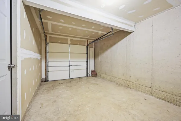 a view of room that has a white car parked
