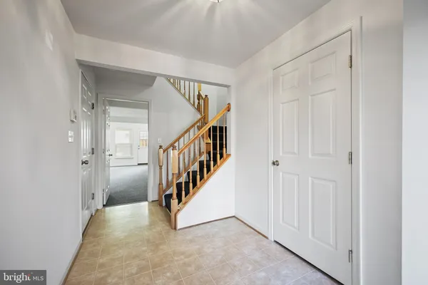 a view of an entryway with hallway