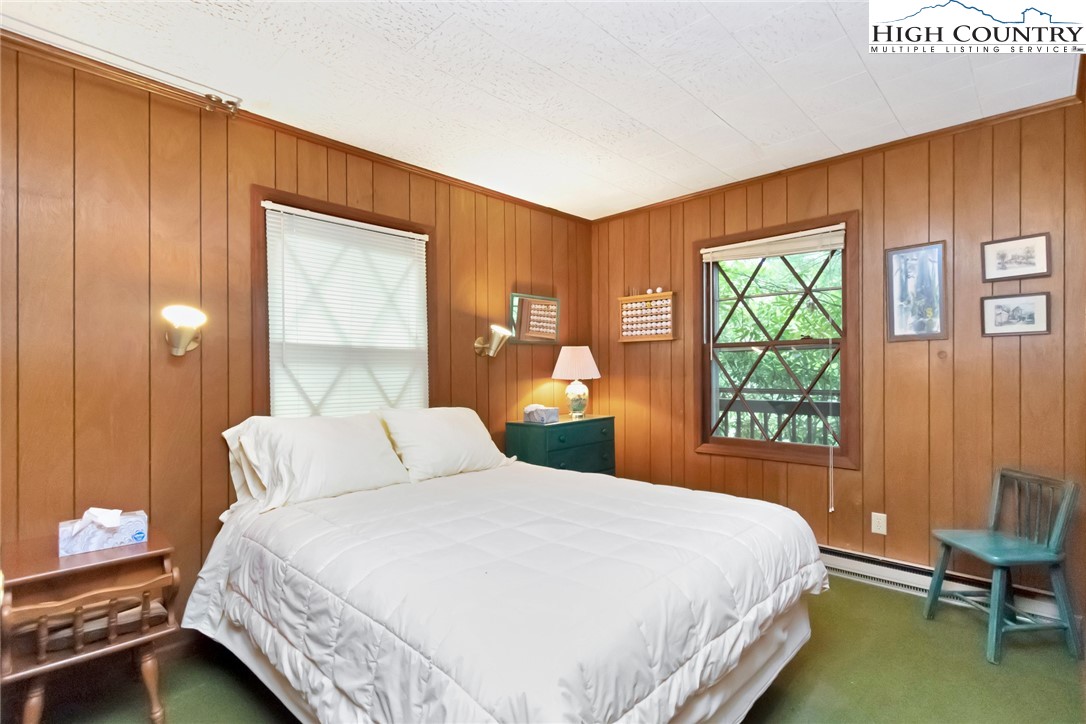 206 Oak Road Beech Mountain, NC 28604 - Photo 24 of 35 a bedroom with a bed and a window