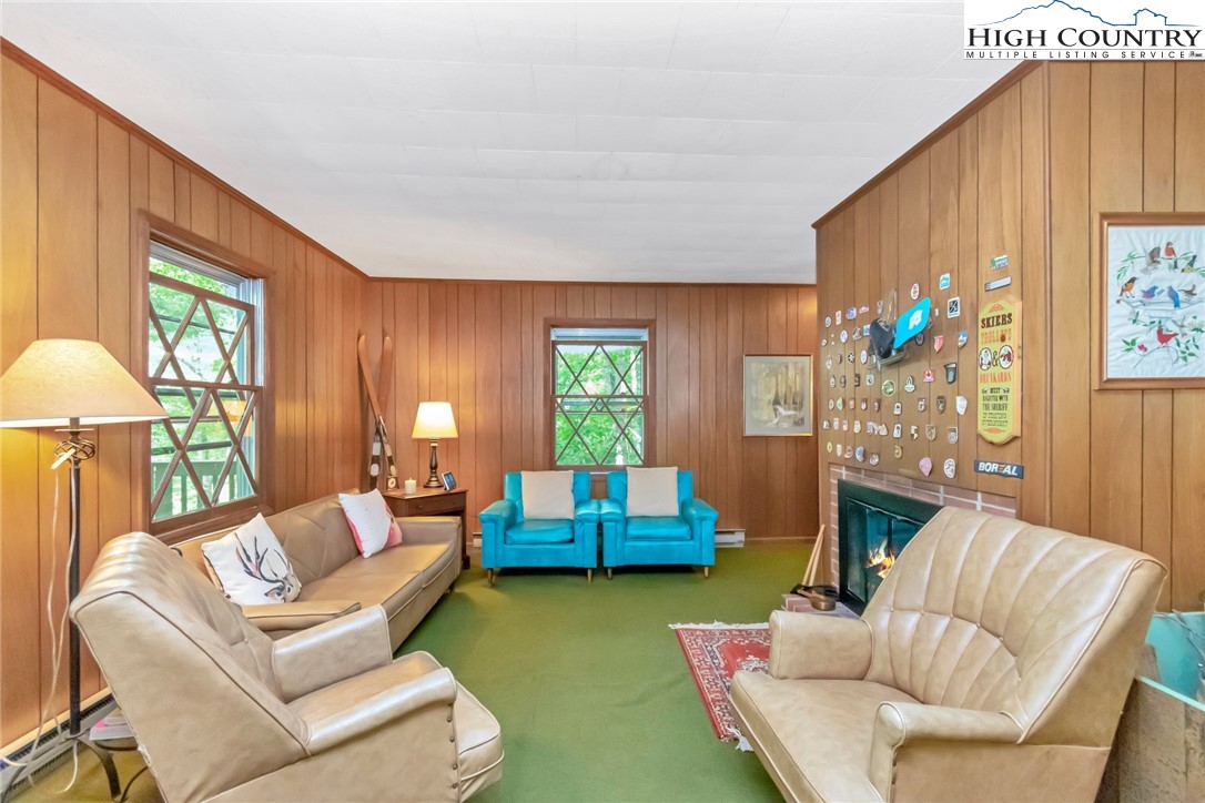 206 Oak Road Beech Mountain, NC 28604 - Photo 8 of 35 a living room with furniture and a window