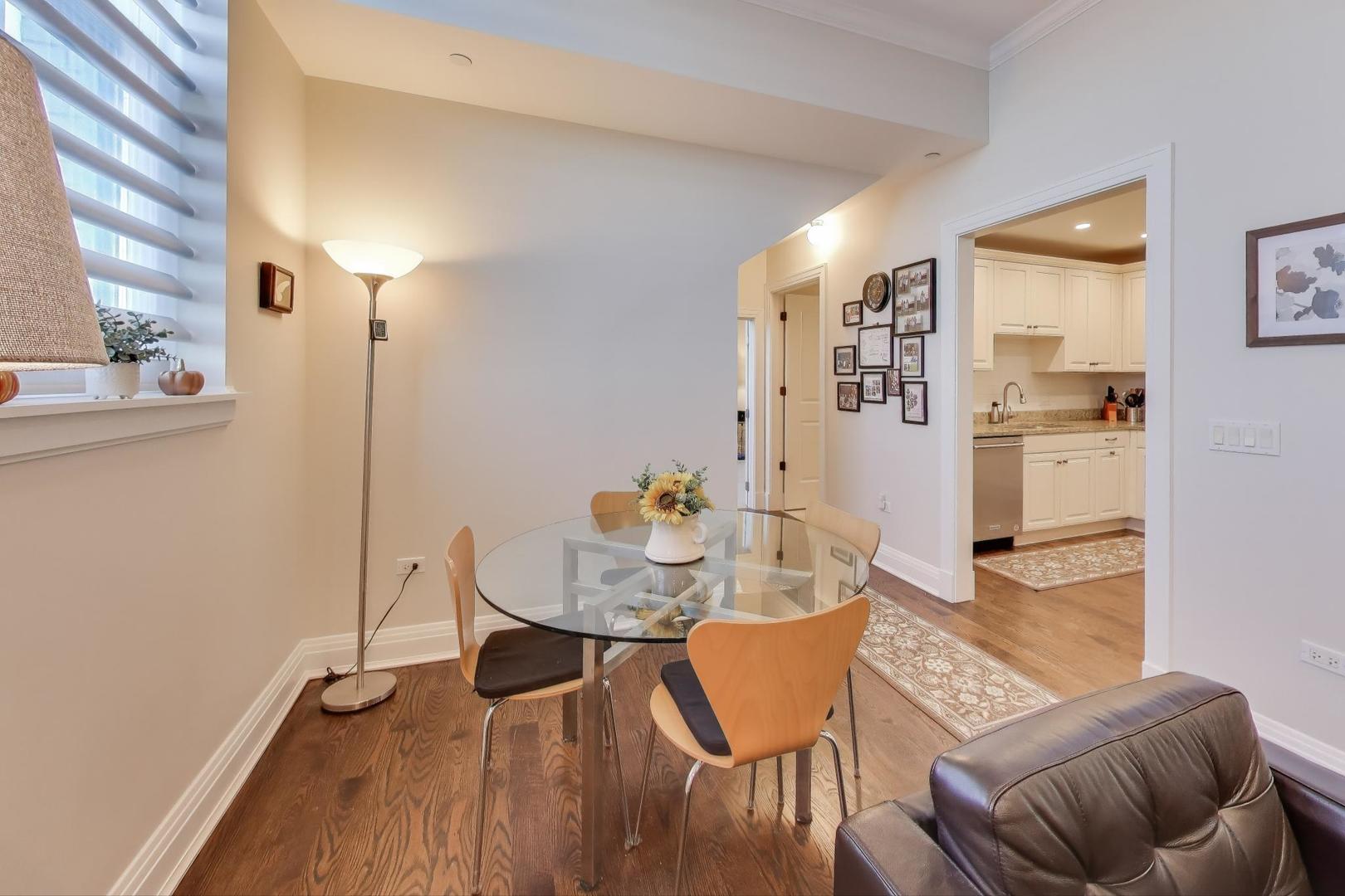 1041 Ridge Road, Unit 503 Wilmette, IL 60091 - Photo 7 of 22 a view of a dining room with furniture and wooden floor