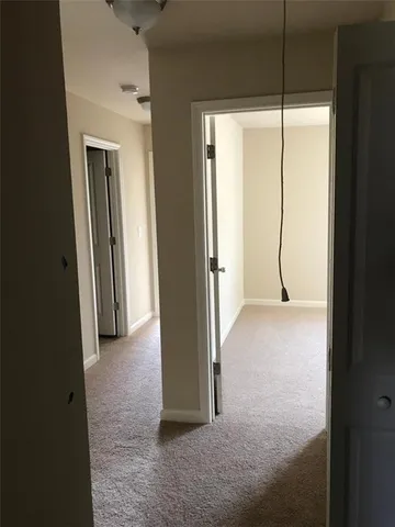 a view of a room with a wardrobe space