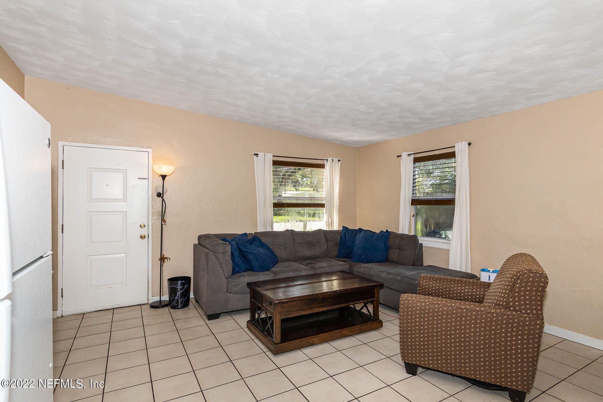 1248 King Arthur Road Jacksonville, FL 32211 - Photo 5 of 23 a living room with furniture and a window