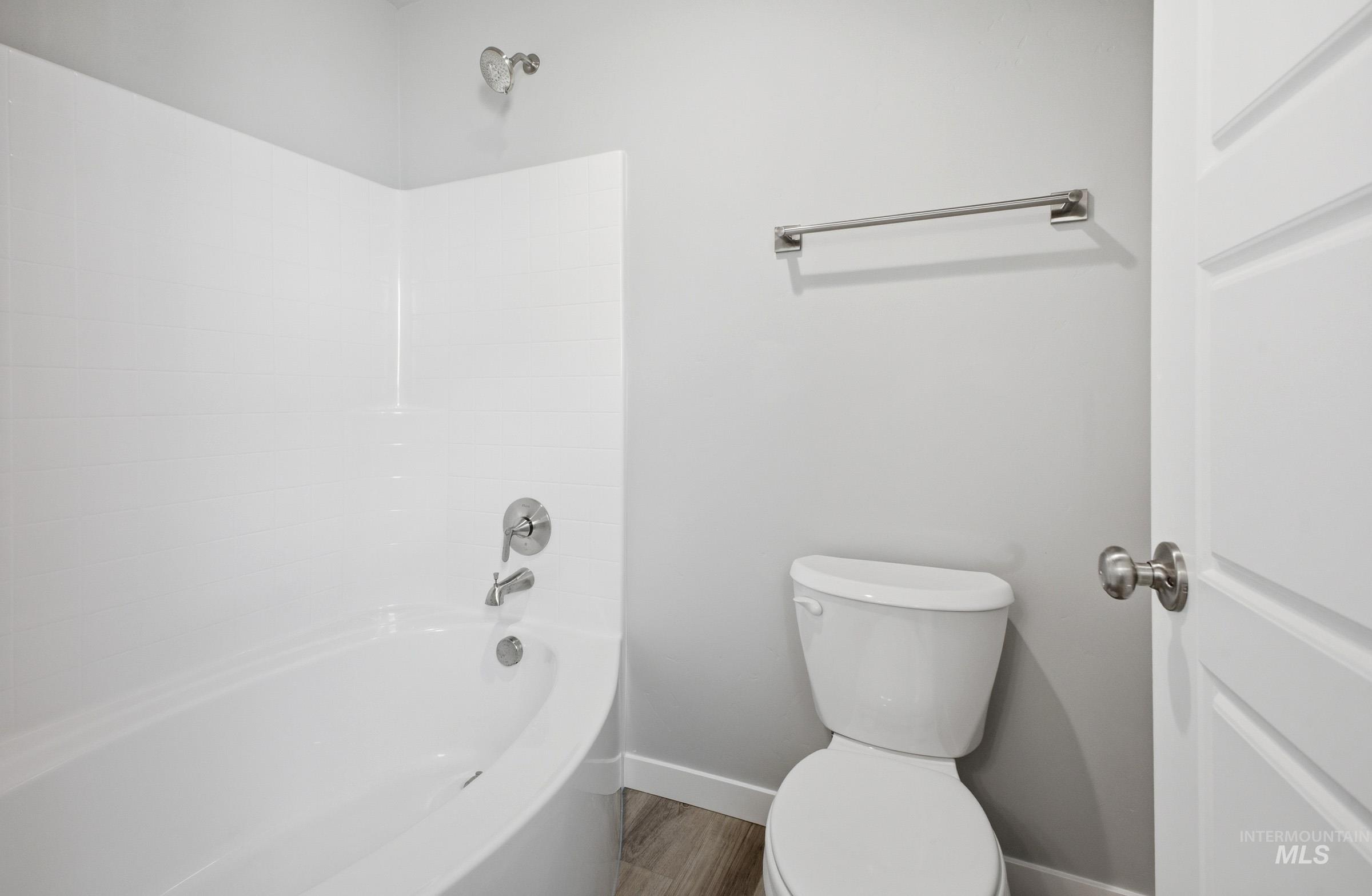 5315 South Memory Avenue Meridian, ID 83642 - Photo 16 of 24 Full bathroom with tub / shower combination and wood finished floors