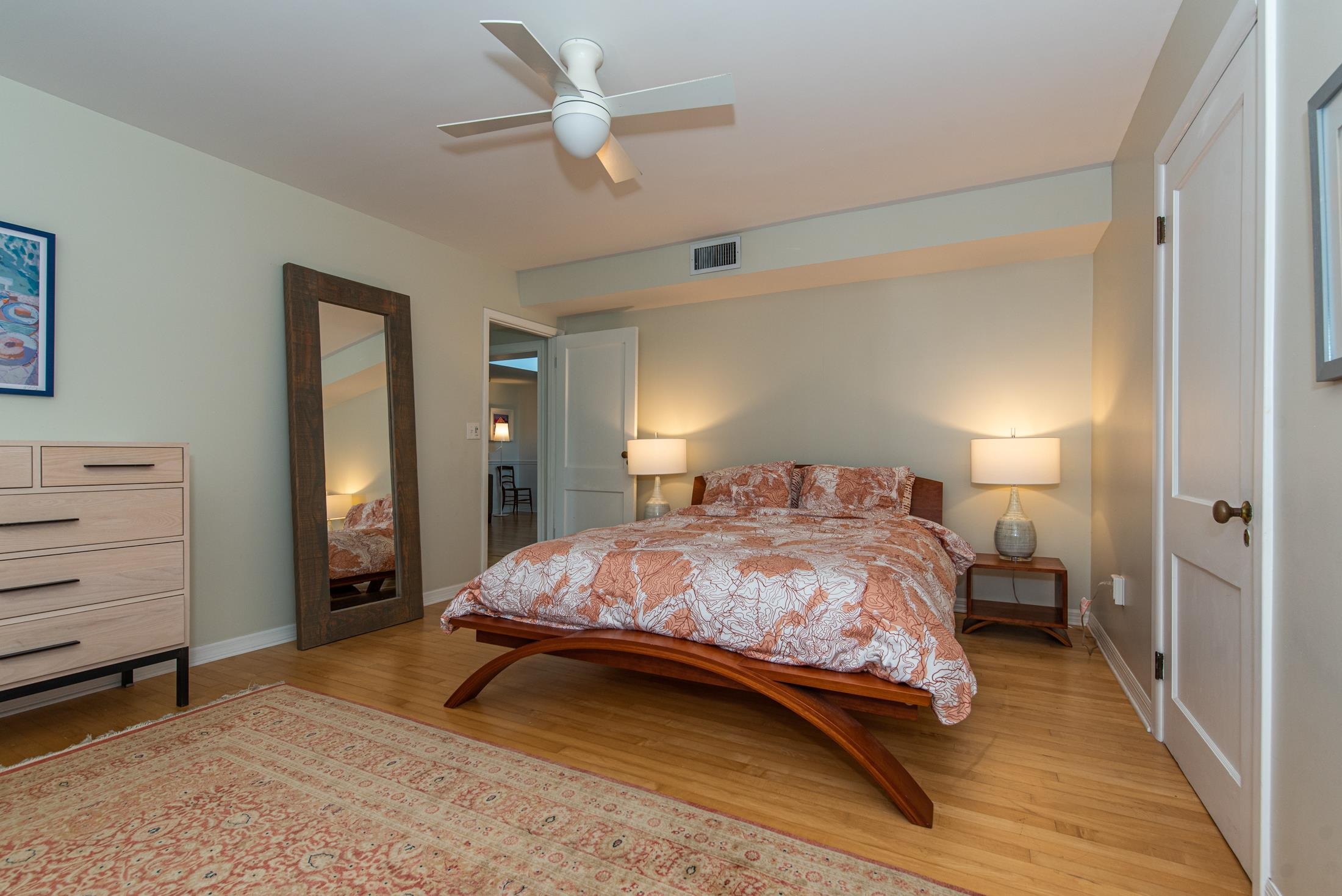 252 South Matanzas Boulevard St. Augustine, FL 32080 - Photo 11 of 32 a bedroom with a bed and a chandelier