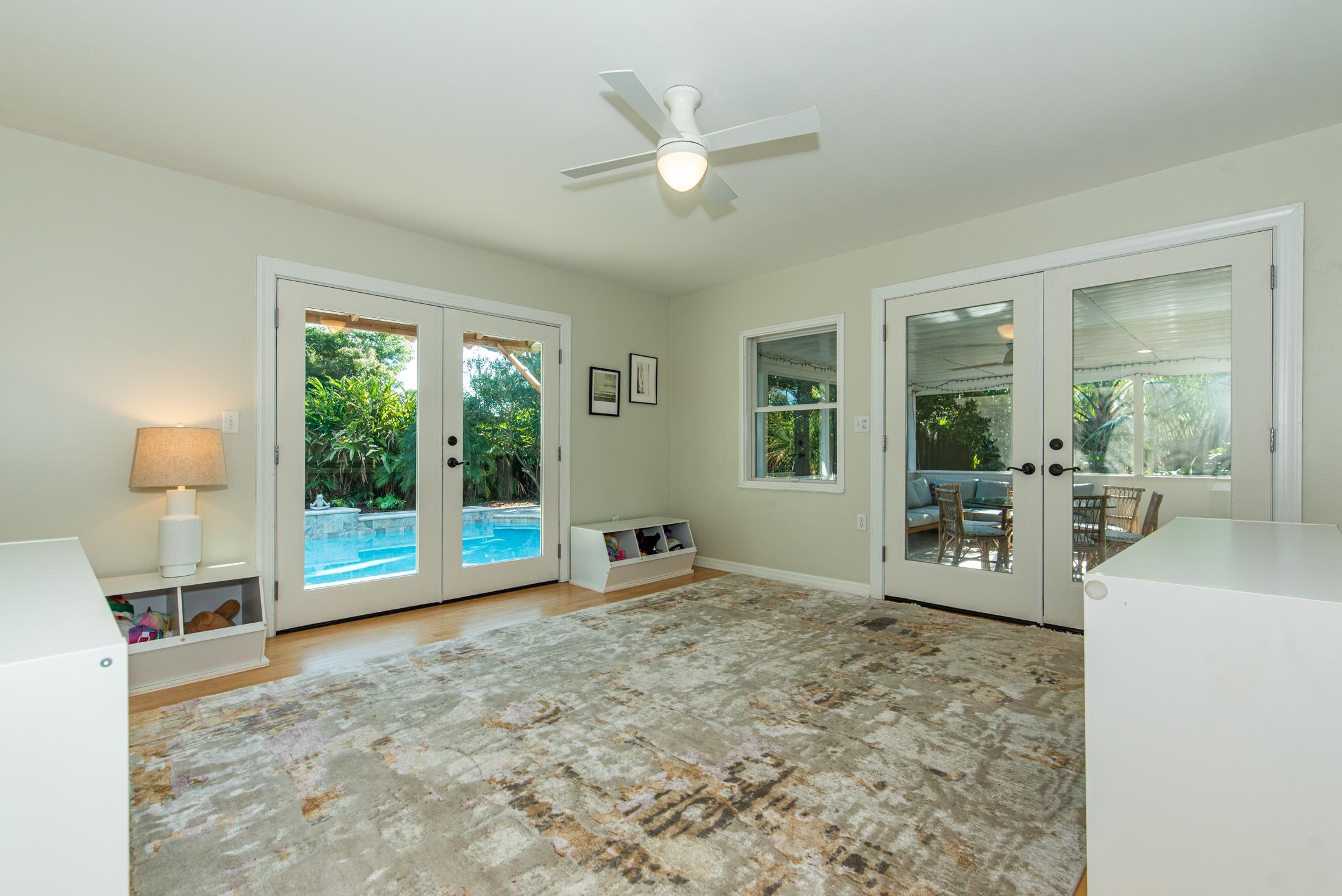 252 South Matanzas Boulevard St. Augustine, FL 32080 - Photo 14 of 32 a view of a livingroom with wooden floor and a ceiling fan