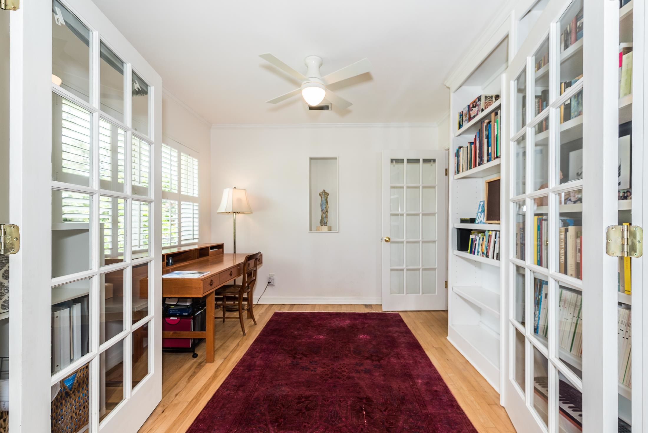 252 South Matanzas Boulevard St. Augustine, FL 32080 - Photo 19 of 32 a bed room with a bed and a book shelf
