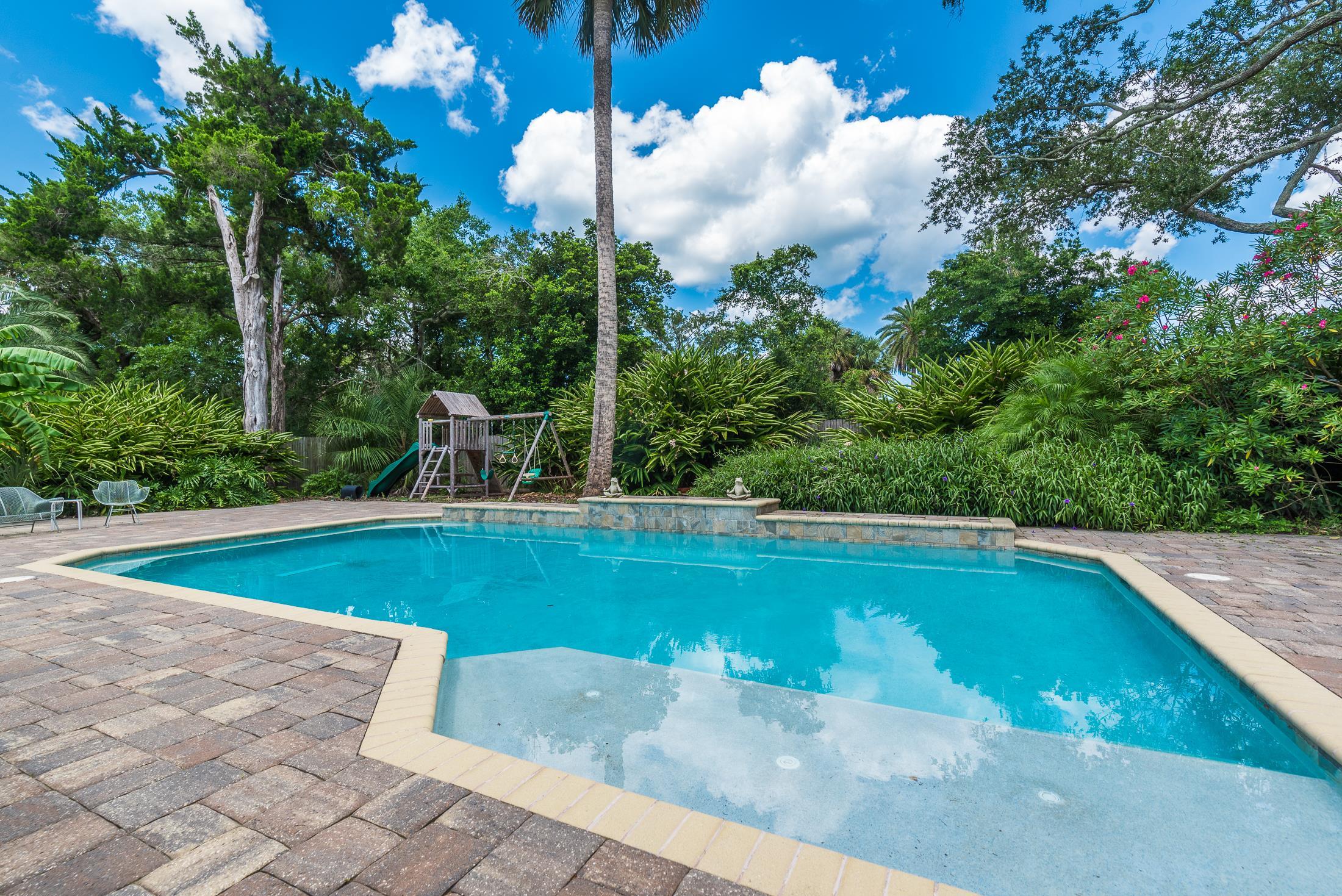 252 South Matanzas Boulevard St. Augustine, FL 32080 - Photo 2 of 32 a view of a swimming pool with an outdoor space