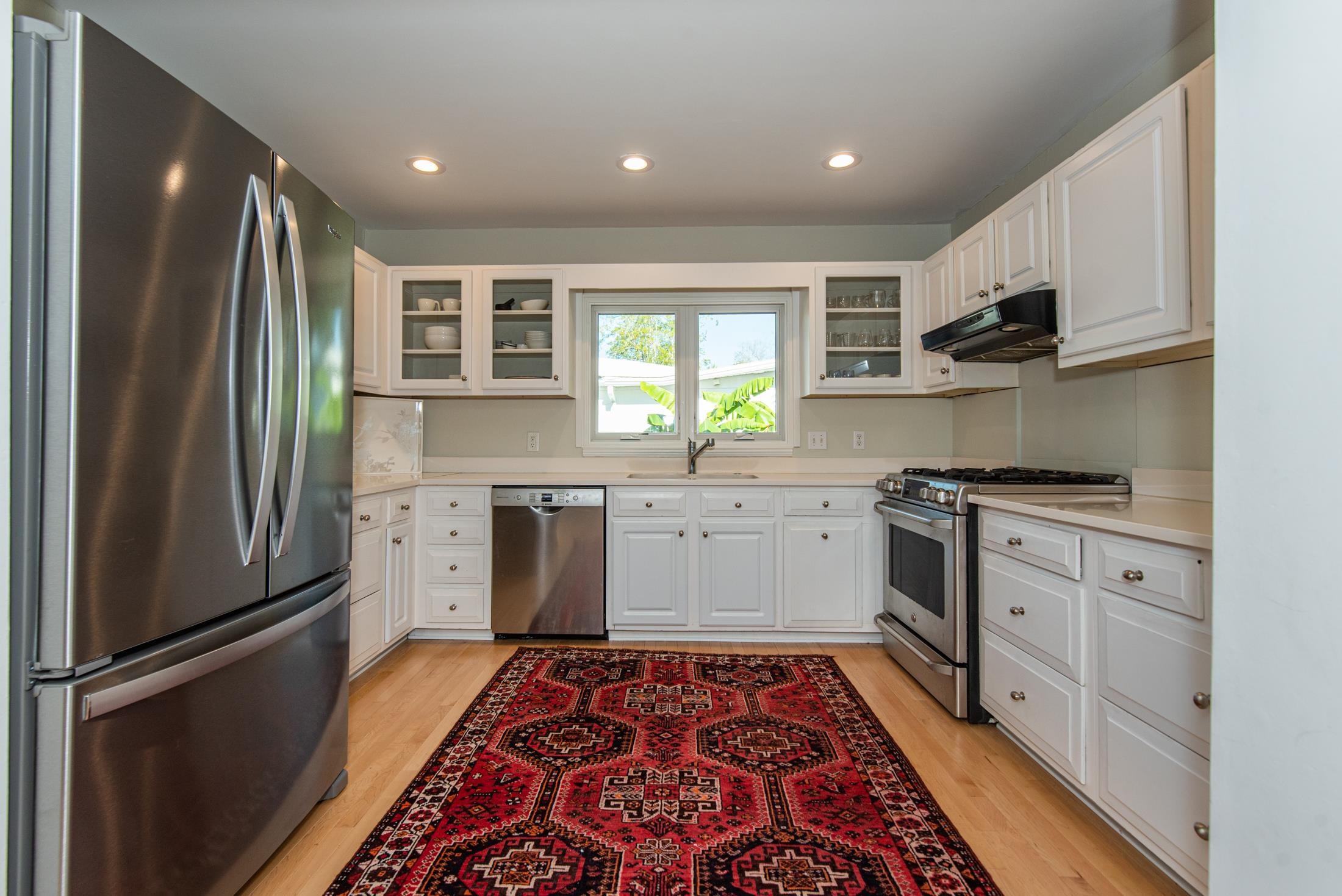 252 South Matanzas Boulevard St. Augustine, FL 32080 - Photo 8 of 32 a kitchen with stainless steel appliances granite countertop a refrigerator sink and stove