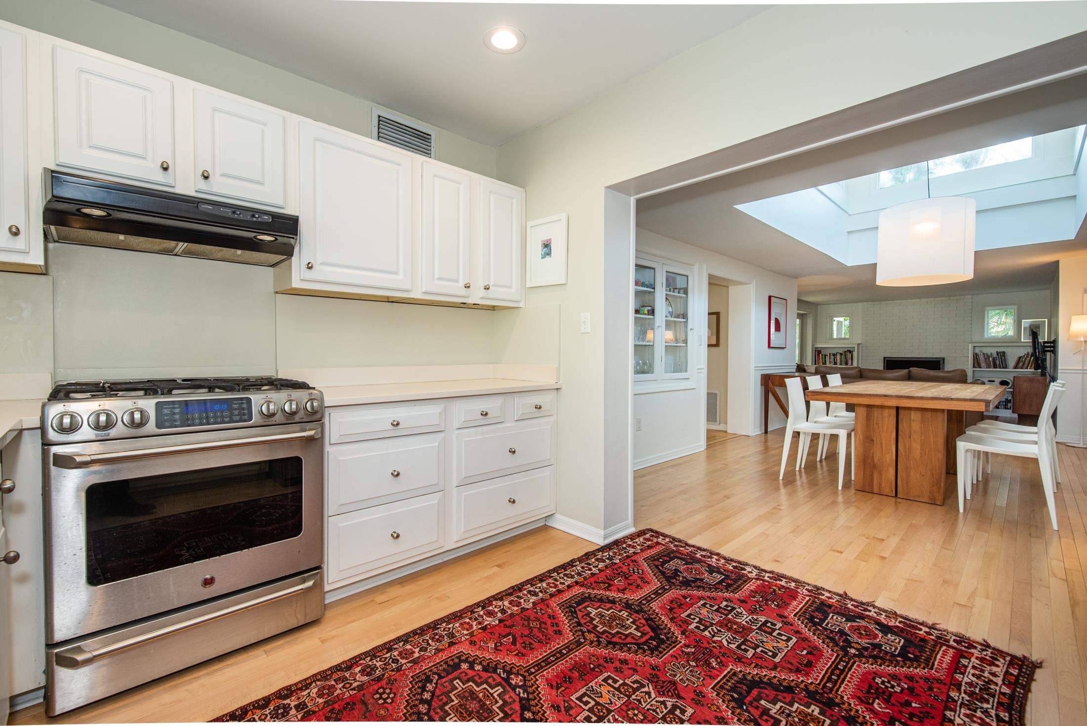 252 South Matanzas Boulevard St. Augustine, FL 32080 - Photo 9 of 32 a kitchen with stainless steel appliances granite countertop a stove a sink and a microwave