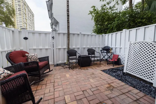 a view of a livingroom with furniture and stairs