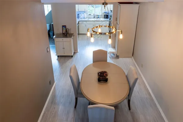 a living room with furniture a flat screen tv and a window