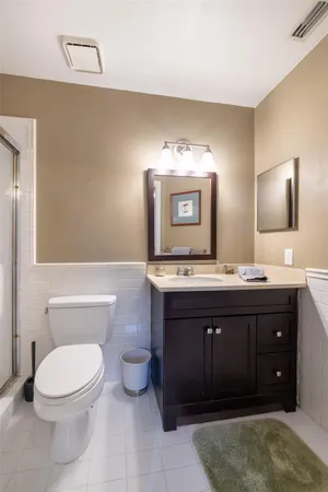 a bedroom with a bed and a dresser in it