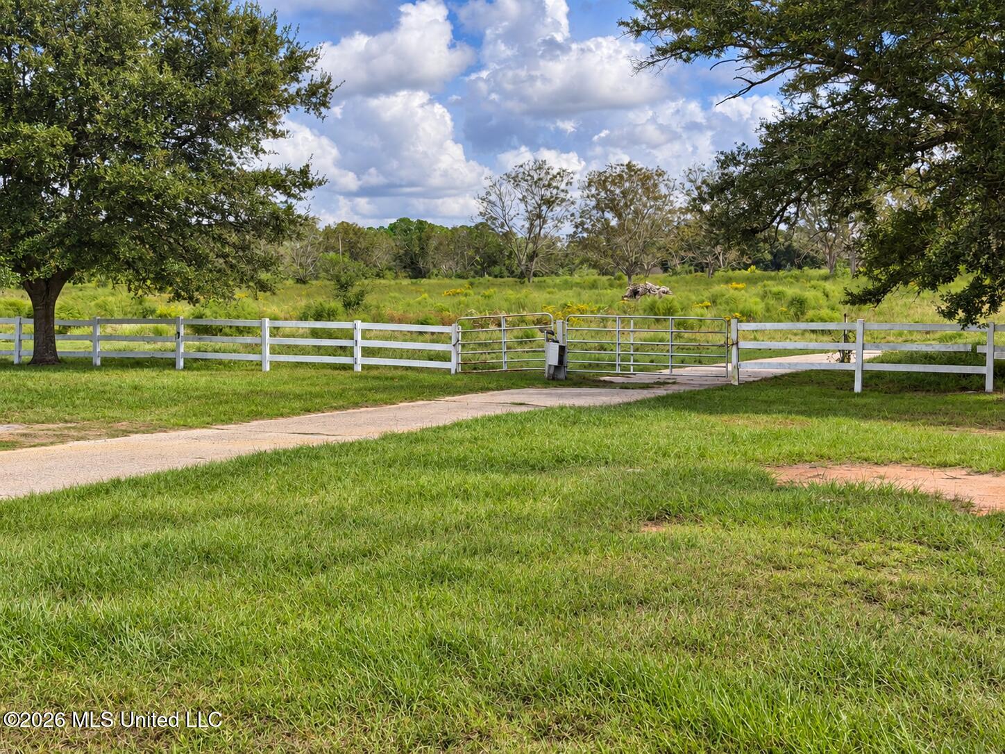 11450 County Farm Road Gulfport, MS 39503 - Photo 77 of 84 Oak-shaded driveway and white gates