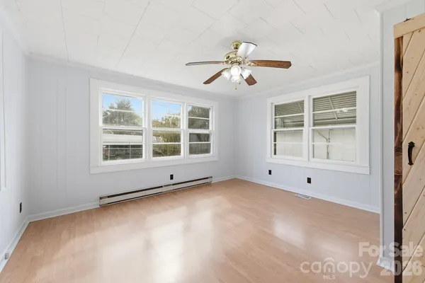 a view of an empty room with a window