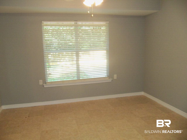 18568 South Greeno Road Fairhope, AL 36532 - Photo 7 of 22 DINING IS LOCATED IN EAT-IN KITCHEN WITH LARGE WINDOW TO BACK YARD.