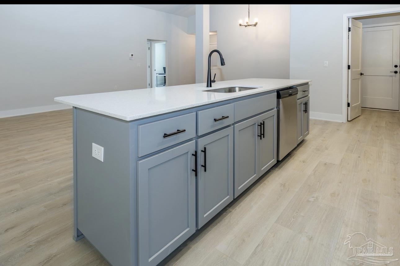 7657 Small Pnes Street Milton, FL 32583 - Photo 10 of 26 a bathroom with a double vanity sink and mirror