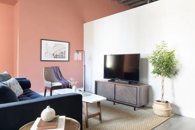 a living room with furniture and a flat screen tv