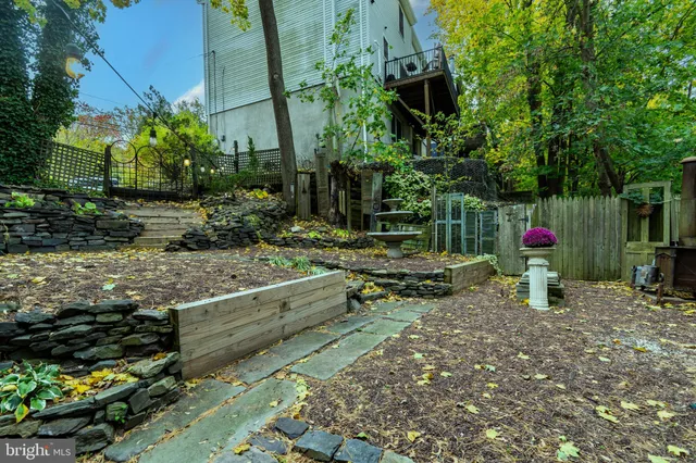 a backyard of a house with barbeque oven