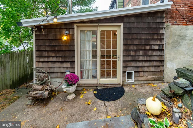 a front view of a house with outdoor seating