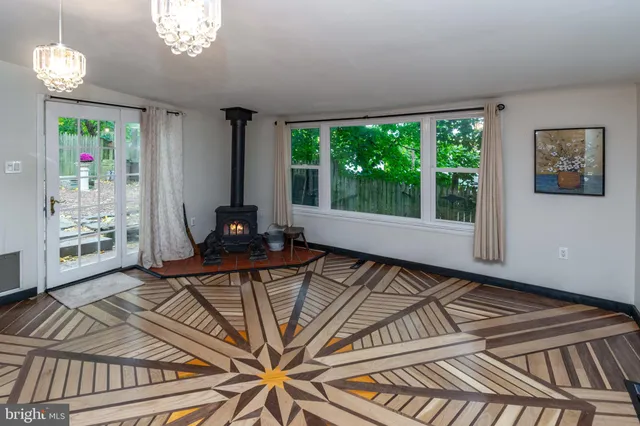 a bed sitting in a room next to a window