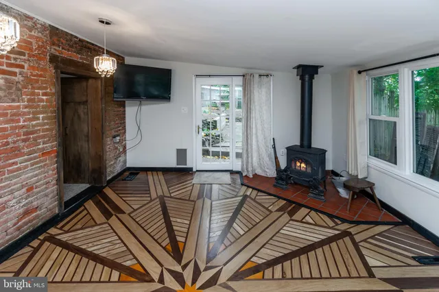 a view of a livingroom with furniture and a fireplace