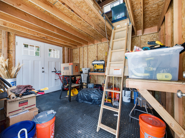 877 South Yarrow Drive Mapleton, UT 84664 - Photo 33 of 46 Utility shed interior featuring exposed wood beam ceiling, plywood walls, and rubberized flooring