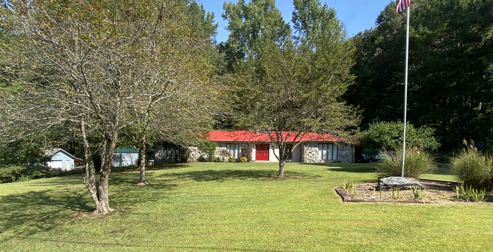 85 John Brown Road Beech Bluff, TN 38313 - Photo 1 of 32 a view of a house with a yard table and chairs