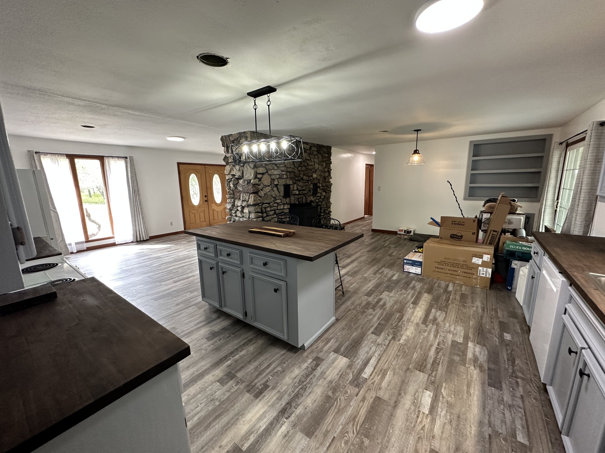 85 John Brown Road Beech Bluff, TN 38313 - Photo 6 of 32 a kitchen with stainless steel appliances granite countertop a stove and a wooden floors