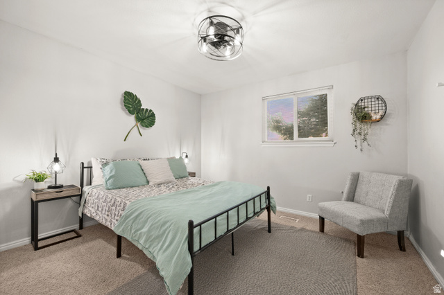 9750 Indian Ridge Drive Sandy, UT 84092 - Photo 24 of 40 Carpeted bedroom with baseboards