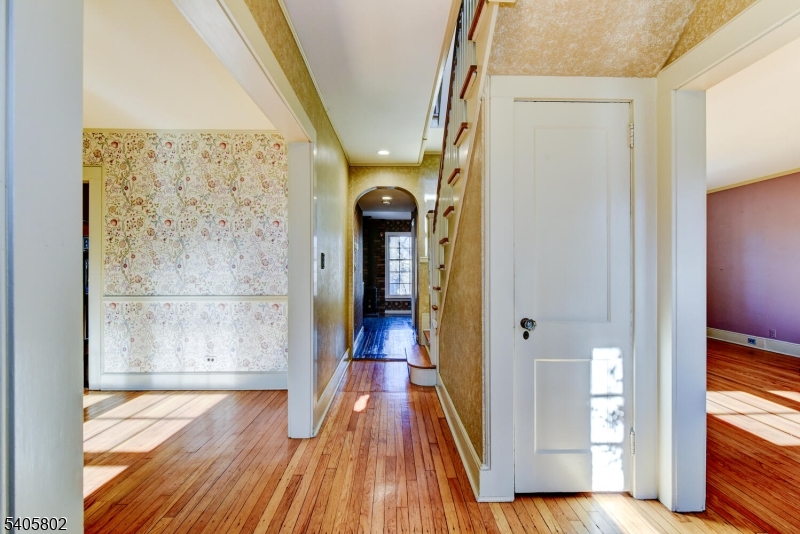 15 Overlook Road Caldwell, NJ 07006 - Photo 14 of 37 a view of a hallway with wooden floor and staircase