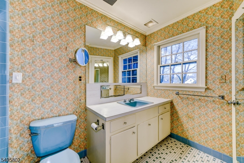 15 Overlook Road Caldwell, NJ 07006 - Photo 22 of 37 a bathroom with a sink and a mirror