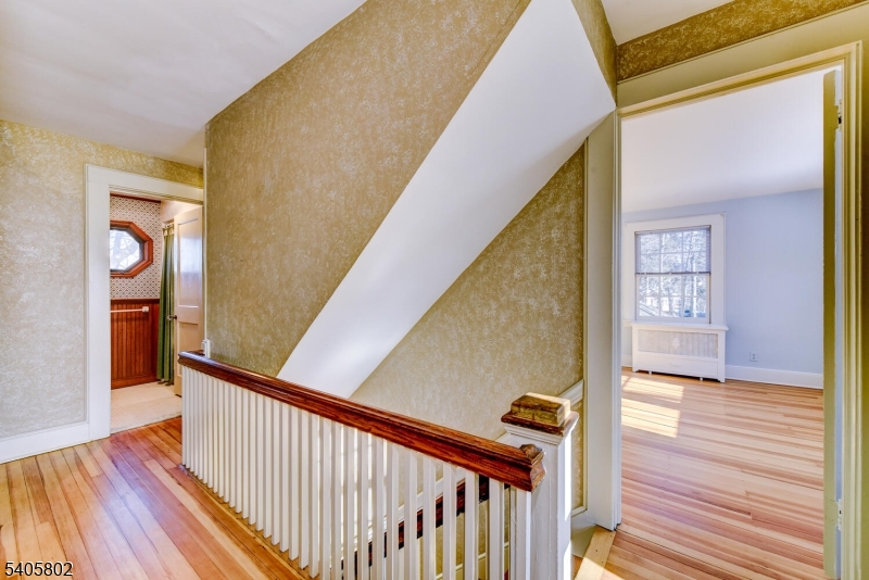 15 Overlook Road Caldwell, NJ 07006 - Photo 25 of 37 a view of a hallway with wooden floor and staircase