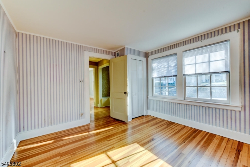 15 Overlook Road Caldwell, NJ 07006 - Photo 27 of 37 a view of an empty room with wooden floor and a window