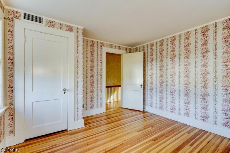 15 Overlook Road Caldwell, NJ 07006 - Photo 28 of 37 a view of an empty room with wooden floor and a window