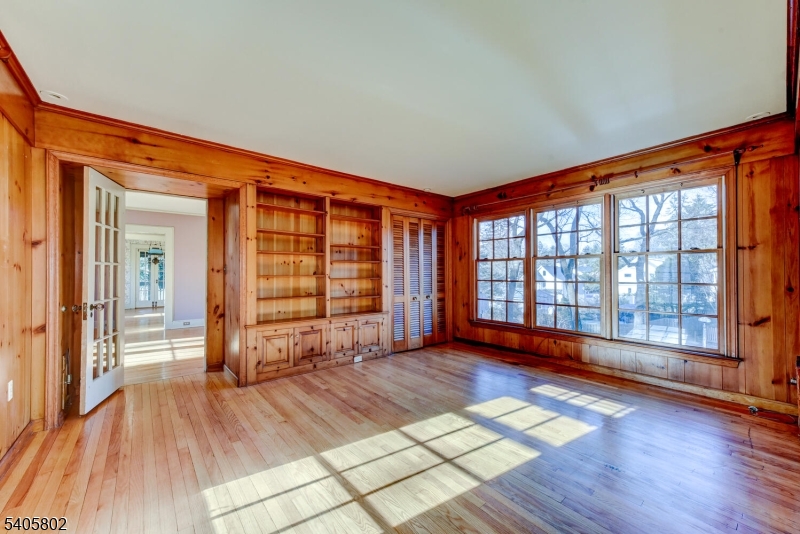 15 Overlook Road Caldwell, NJ 07006 - Photo 3 of 37 an empty room with wooden floor and windows