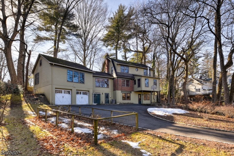 15 Overlook Road Caldwell, NJ 07006 - Photo 33 of 37 a view of a house with a yard covered in snow