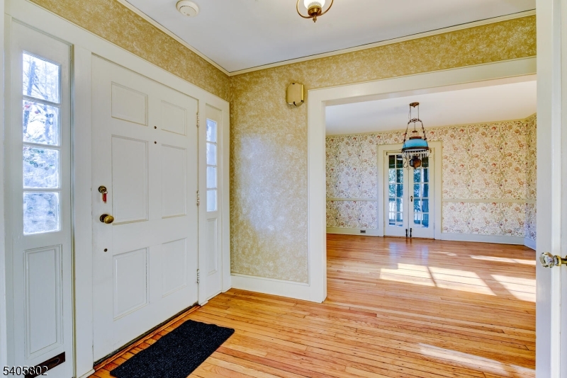 15 Overlook Road Caldwell, NJ 07006 - Photo 9 of 37 a view of a hallway with wooden floor and front door