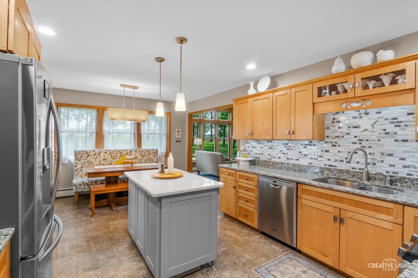 14050 Townhouse Road Newark, IL 60541 - Photo 12 of 45 a kitchen with stainless steel appliances granite countertop a sink and a stove