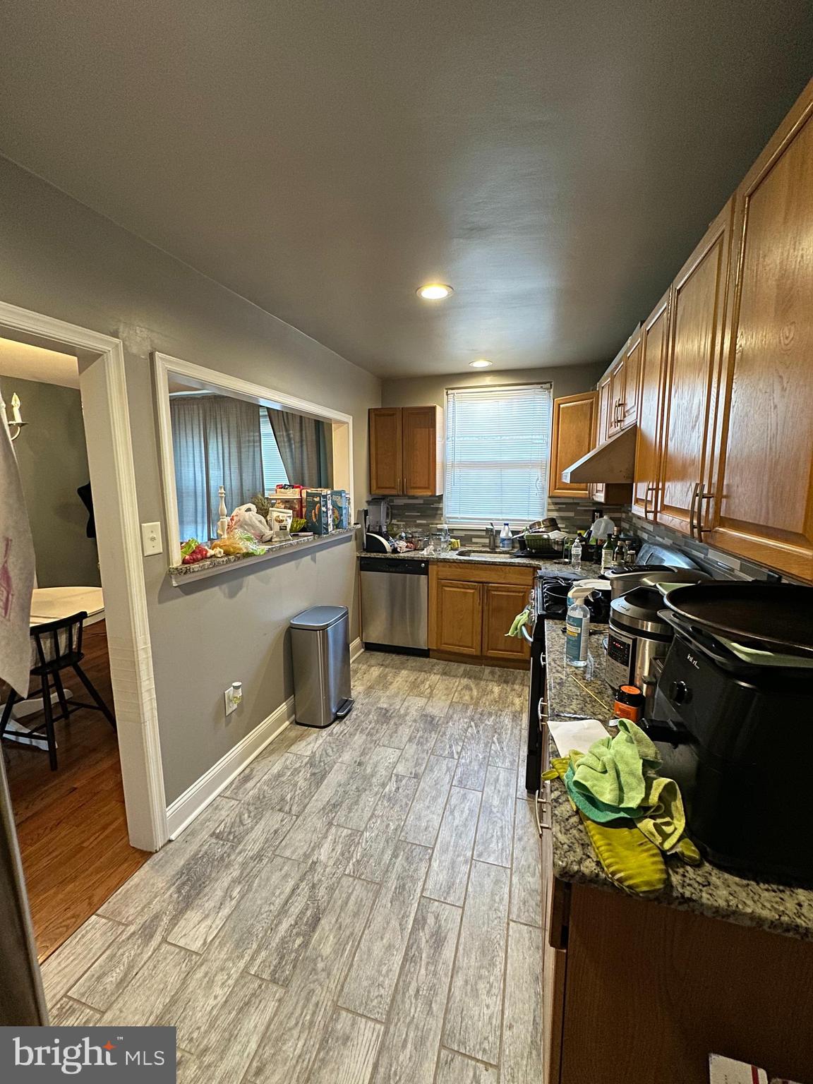 610 Andover Road Upper Darby, PA 19082 - Photo 8 of 22 a kitchen with stainless steel appliances granite countertop a stove top oven a sink a counter space and cabinets
