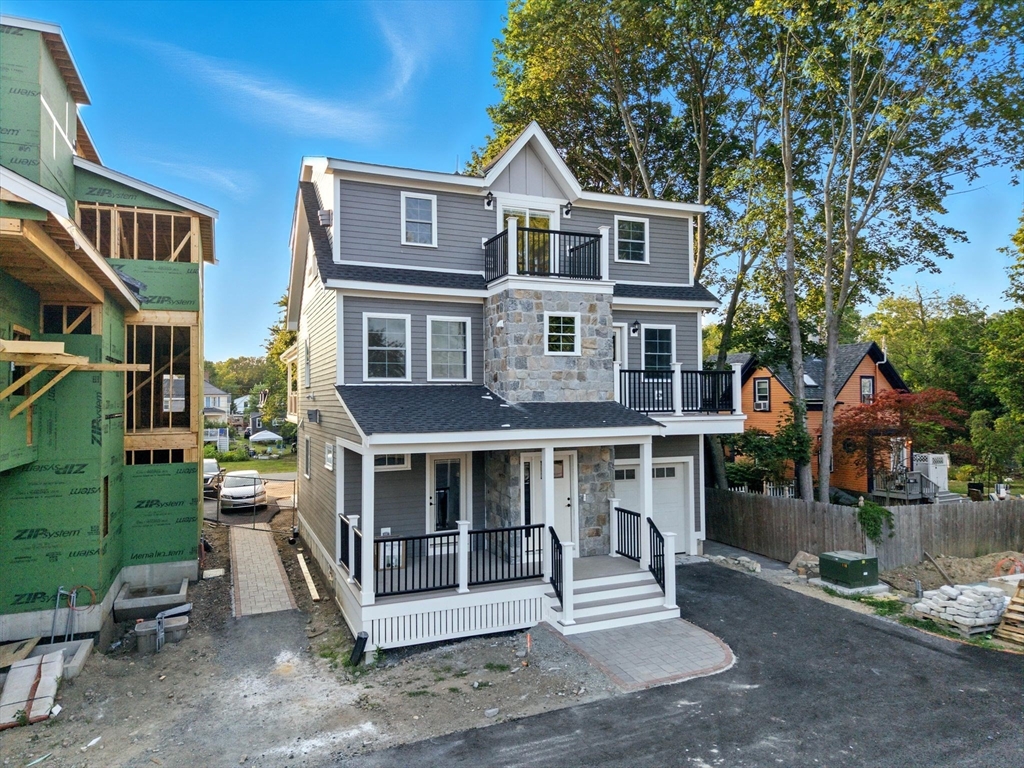 11-9 Washington Street, Unit NINE Ipswich, MA 01938 - Photo 31 of 33 a front view of a house with a porch