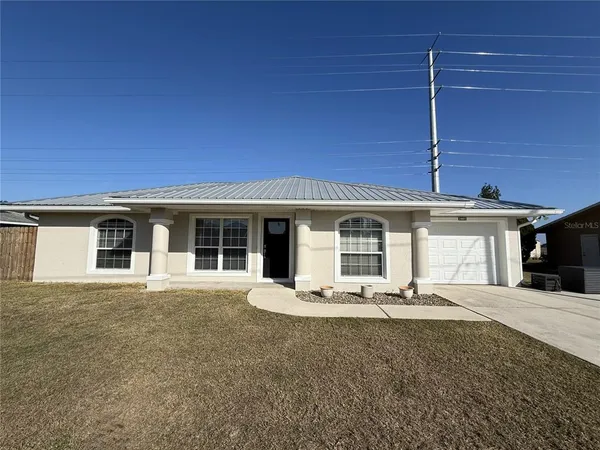 a front view of a house with a patio